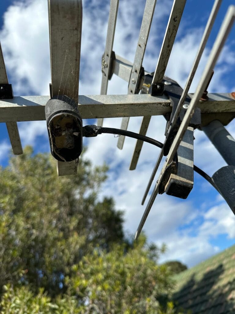 Rusted analogue TV antenna on Melbourne rooftop needing digital upgrade