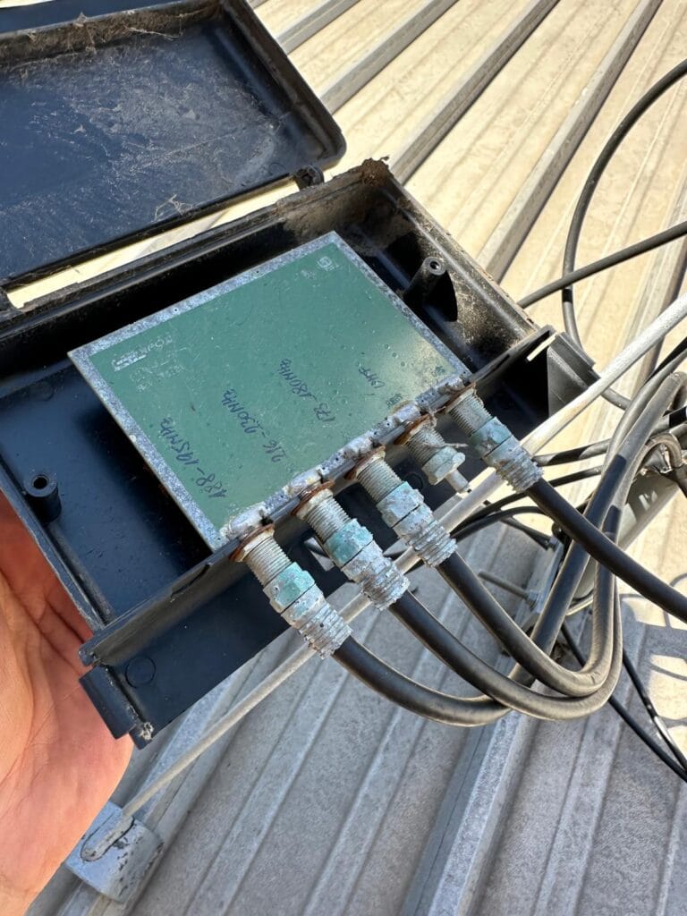 Corroded and rusted diplexer filter on TV antenna system – signal quality issue