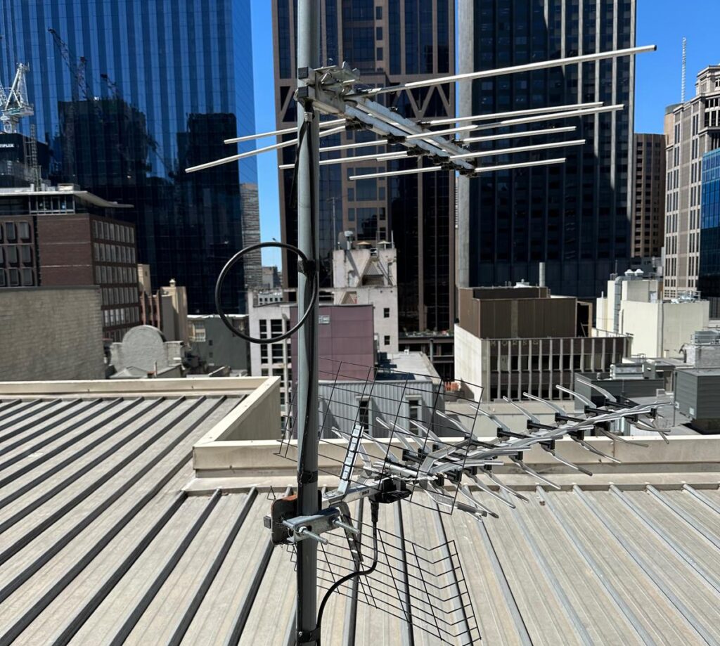 Misaligned analogue TV antenna on Melbourne CBD tower requiring digital TV system upgrade